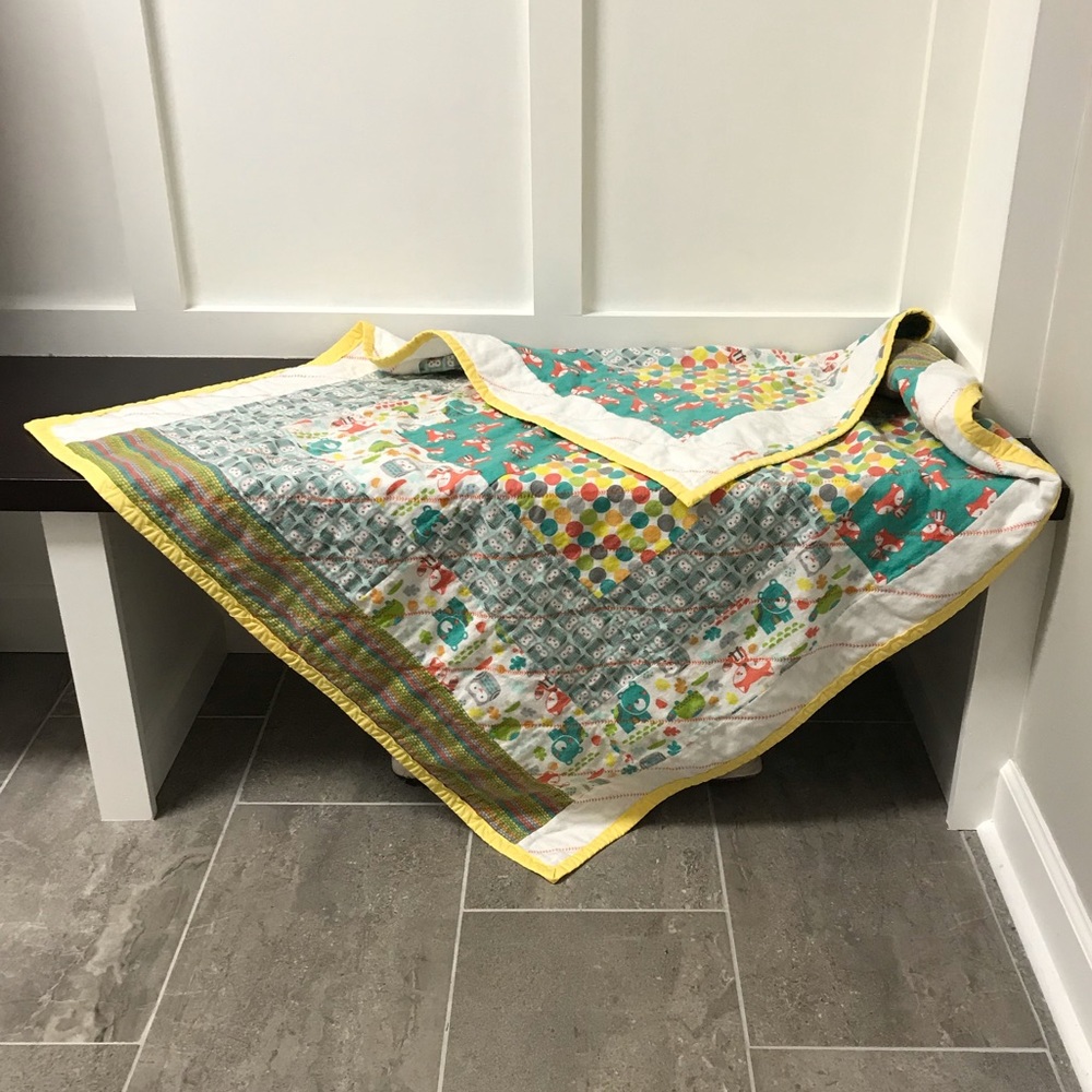 Handmade reversible quilted crib blanket